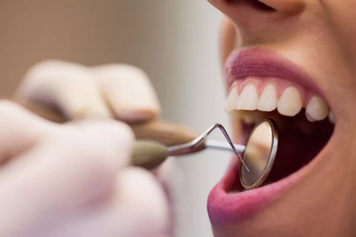 dentist-examining-female-patient-with-tools-1 (1)